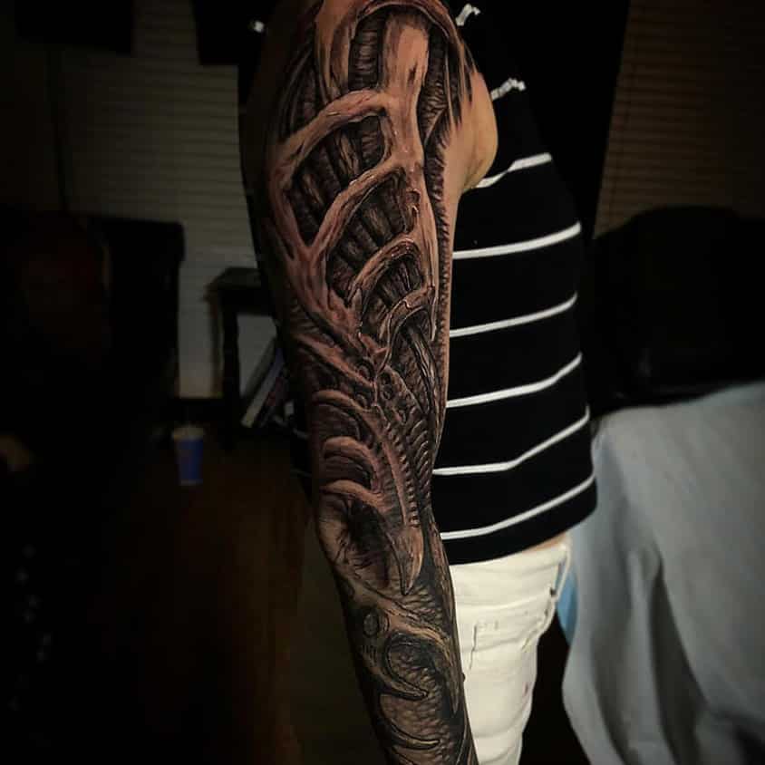 Surreal sleeve tattoo by Cory James